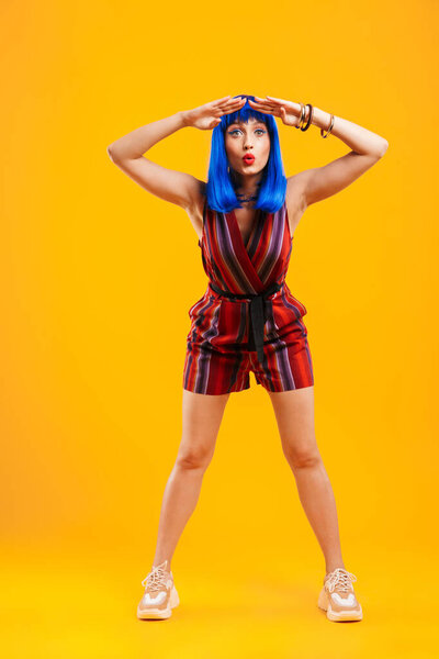 Portrait of an attractive funky young girl with blue hair