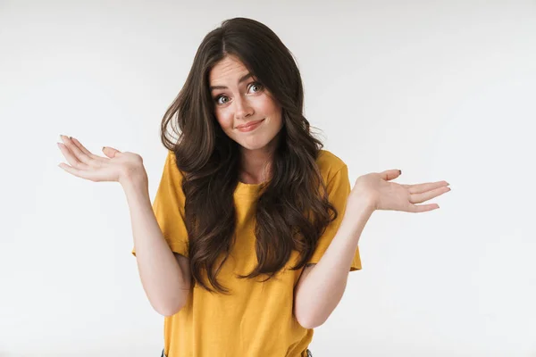 Image of caucasian brunette woman wearing casual t-shirt shruggi — Stock Photo, Image