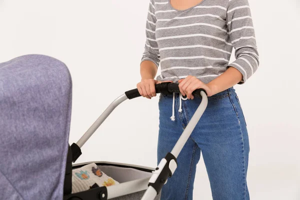 Cropped image of caucasian woman walking with stroller — Stock Photo, Image