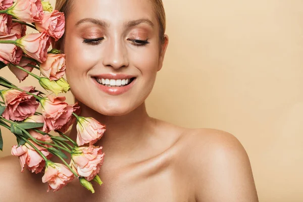 Positive amazing gorgeous blonde woman with flowers. — Stock Photo, Image