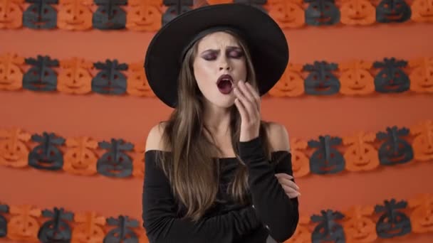 Calm Beautiful Young Witch Woman Black Halloween Costume Becoming Tired — ストック動画