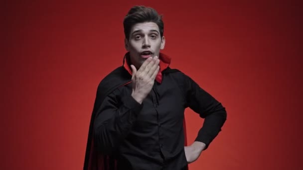 Vampire Man Blood Fangs Black Halloween Costume Blowing Kiss Isolated — Stock Video