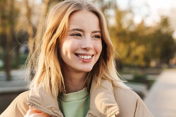 Portrait Young Blonde Woman Wearing Jacket Smiling Looking Aside While — Stock Photo, Image