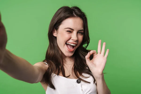 Image Excited Woman Gesturing Sign Taking Selfie Photo Isolated Green — Stock Photo, Image