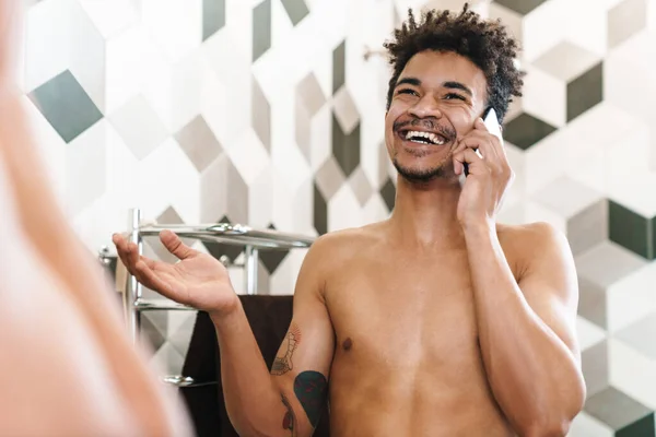 Photo Laughing Half Naked African American Man Talking Cellphone While — Stock Photo, Image