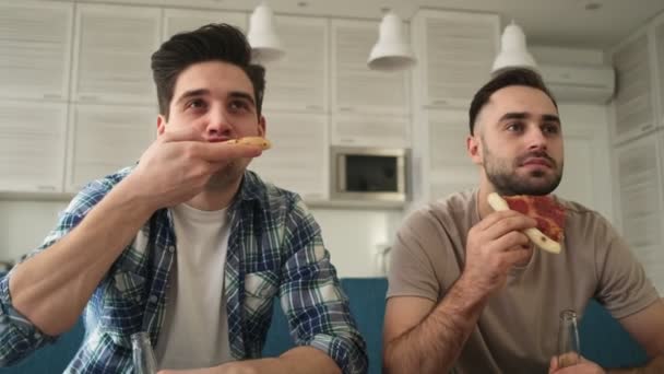 Happy Relaxed Guys Watching While Eating Snacks Pizza Drinking Beer — Stock Video