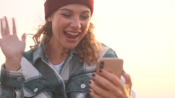 Cheerful Blonde Woman Wearing Hat Plaid Shirt Talking Videocall Smartphone — Stock Video
