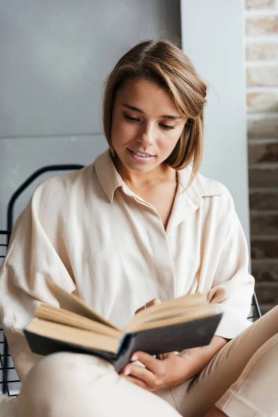 Image Young Caucasian Nice Woman Stylish Pajamas Reading Book While — Stock Photo, Image