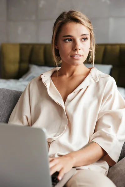 Image Serious Nice Woman Pajama Working Laptop While Sitting Sofa — Stock Photo, Image