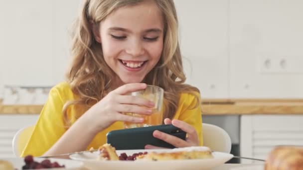 Cheerful Happy Young Girl Looking Her Smartphone Holding Horizontally Breakfast — Stock Video