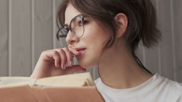 Close View Positive Woman Wearing Glasses Reading Book Cozy Room — Stock Video