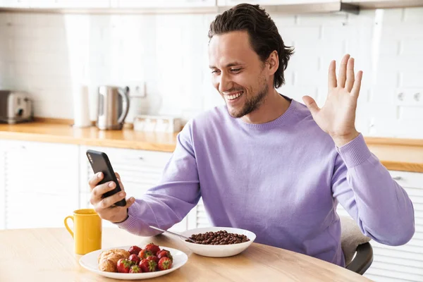 Attractive Happy Young Man Sitting Kitchen Table Having Breakfast Eating — Stock Photo, Image