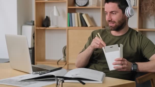 Handsome Young Man Watching Something Interesting His Laptop While Sitting — Stock Video