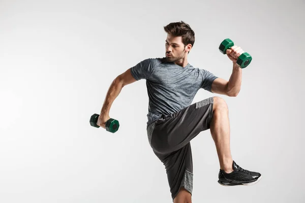 Confident Young Sportsman Exercising Dumbbells Isolated Gray Background — Stock Photo, Image