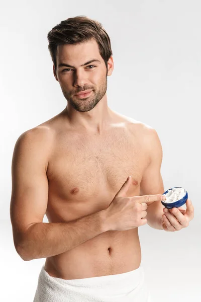 Photo Handsome Half Naked Man Bath Towel Applying Facial Cream — Stock Photo, Image