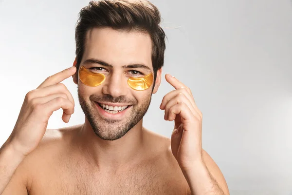 Photo Happy Half Naked Man Eye Patches Looking Camera Smiling — Stock Photo, Image