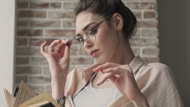 Young Tired Woman Sitting Indoors Home Taking Her Glasses Reading — Stock Video