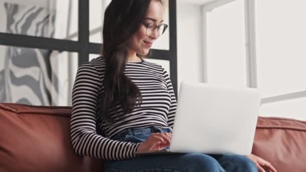 Smiling Pretty Asian Woman Eyeglasses Using Laptop Computer While Sitting — Stock Video