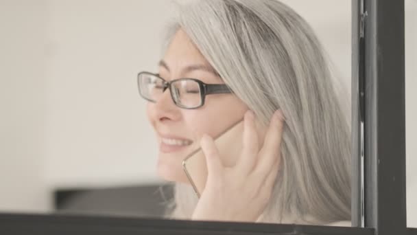 Happy Mature Woman Wearing Glasses Talking Her Smartphone Standing Living — Stock Video