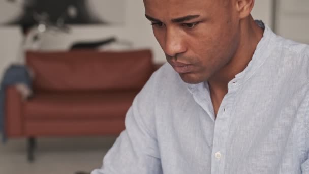Close Cropped View Focused African American Man Using His Laptop — Stock Video