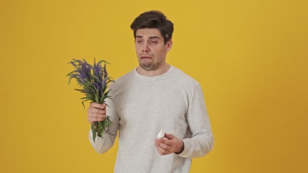 Unhappy Sick Man Sniffing Flowers Having Allergy Using Spray Yellow — Stock Video