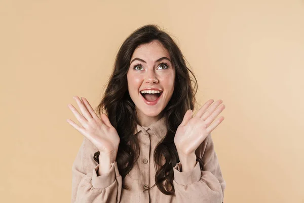 Image Delighted Attractive Woman Expressing Surprise Camera Isolated Beige Background — Stock Photo, Image