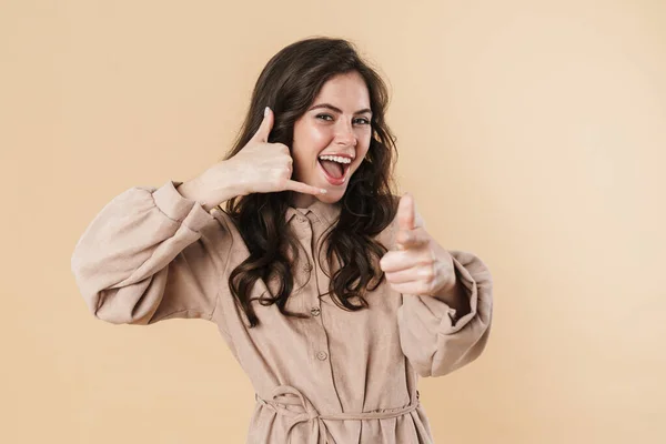 Image Excited Woman Pointing Finger Camera Showing Handset Gesture Isolated — Stock Photo, Image