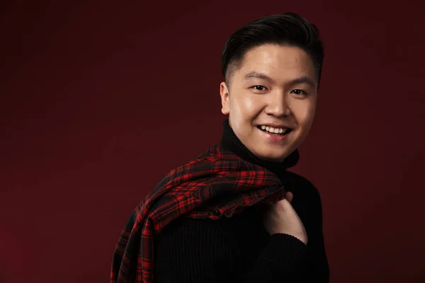Image Cheerful Asian Man Smiling Holding Plaid Shirt Isolated Burgundy — Stock Photo, Image