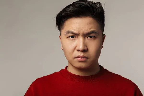 Image Displeased Young Asian Man Posing Looking Camera Isolated Gray — Stock Photo, Image