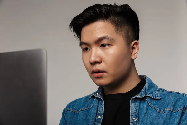 Image Closeup Focused Handsome Asian Man Working Laptop Isolated Gray — Stock Photo, Image