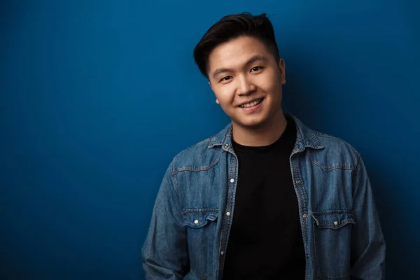 Image Pleased Handsome Asian Man Smiling Looking Camera Isolated Blue — Stock Photo, Image