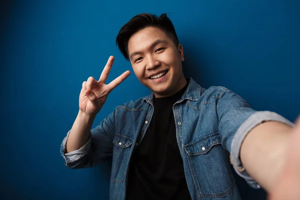 Image Laughing Handsome Asian Man Gesturing Peace Sign Taking Selfie — Stock Photo, Image