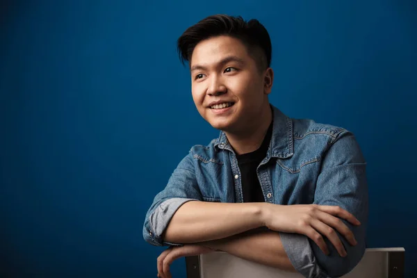 Image Excited Handsome Asian Man Smiling While Sitting Chair Isolated — Stock Photo, Image