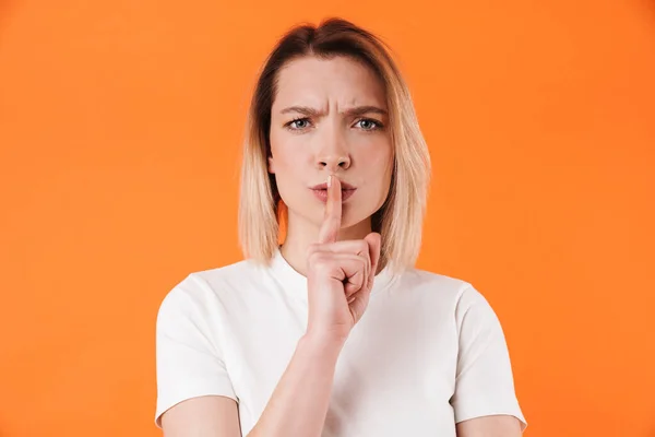 Image Displeased Pretty Woman Making Silence Gesture Isolated Orange Background — Stock Photo, Image