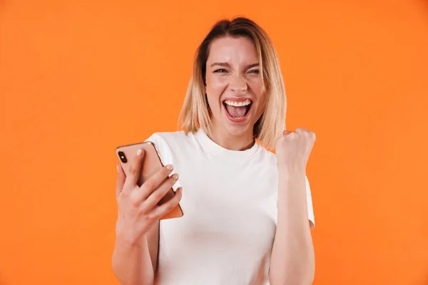 Image Delighted Woman Making Winner Gesture While Using Mobile Phone — Stock Photo, Image