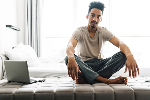 Photo Handsome African American Man Mustache Sitting Laptop Sofa Bright — Stock Photo, Image