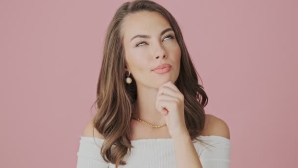 Serious Young Woman Thinking Something Standing Isolated Pink Background Studio — Stock Video