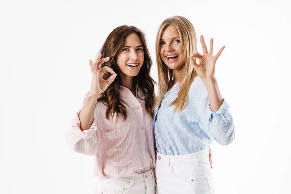 Image Smiling Beautiful Two Women Gesturing Sign While Hugging Isolated — Stock Photo, Image
