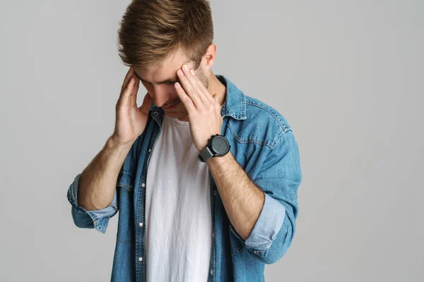 Portrait Unhappy Young Man Headache Rubbing His Temples Isolated Grey — Stock Photo, Image