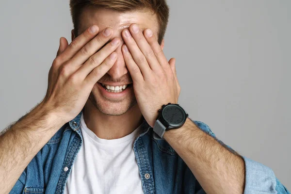 Portrait Cheerful Unshaven Man Laughing Covering His Eyes Isolated Grey — Stock Photo, Image