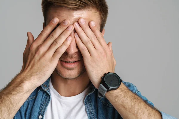Portrait Calm Unshaven Man Posing Covering His Eyes Isolated Grey — Stock Photo, Image