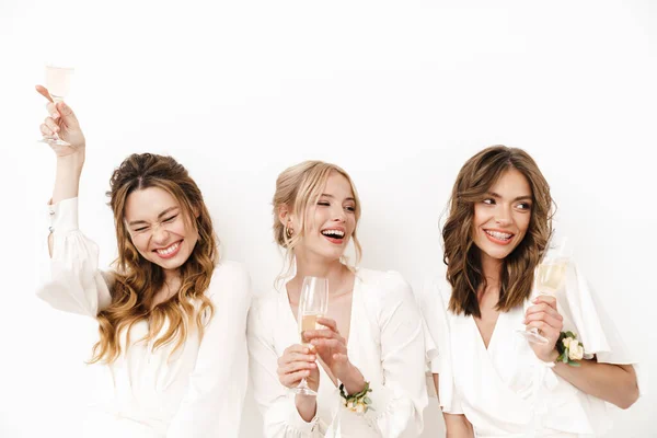 Photo Joyful Beautiful Bridesmaids Laughing Drinking Champagne Isolated White Wall — Stock Photo, Image