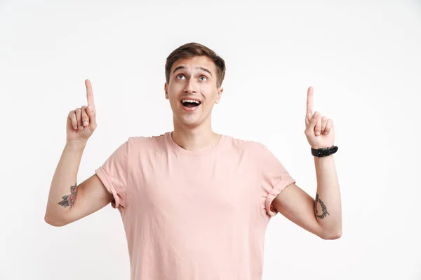 Image Joyous Young Man Basic Shirt Smiling Pointing Fingers Upward — Stock Photo, Image