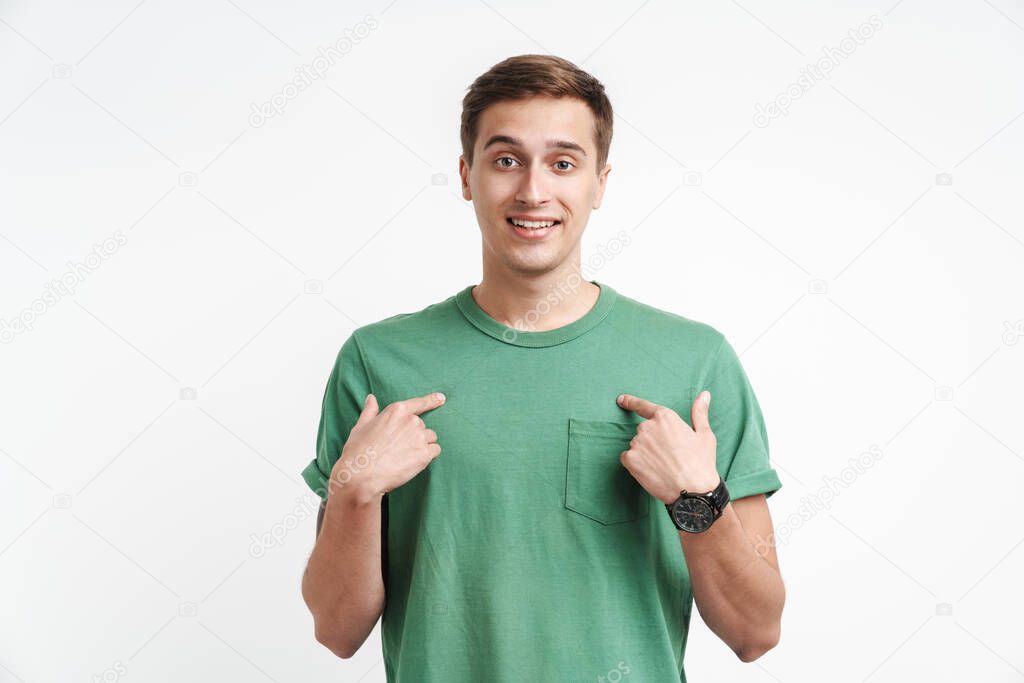 Image of happy caucasian man in basic t-shirt smiling and pointing fingers at himself isolated over white background