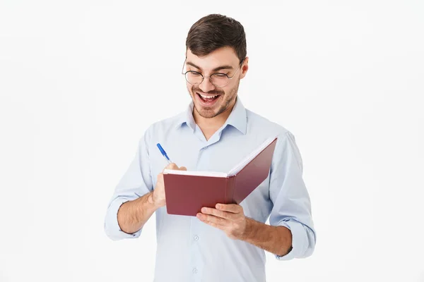 Photo Smiling Handsome Man Eyeglasses Making Notes Diary Isolated White — Stock Photo, Image