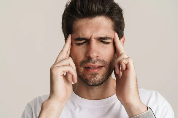Image Unhappy Young Man Headache Rubbing His Temples Isolated White — Stock Photo, Image