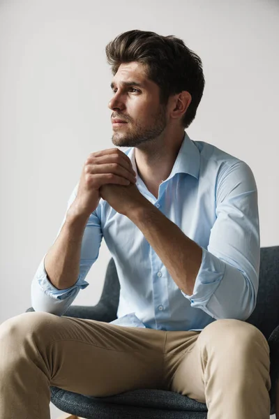 Image Serious Businesslike Brunette Man Thinking Sitting Chair White Wall — Stock Photo, Image