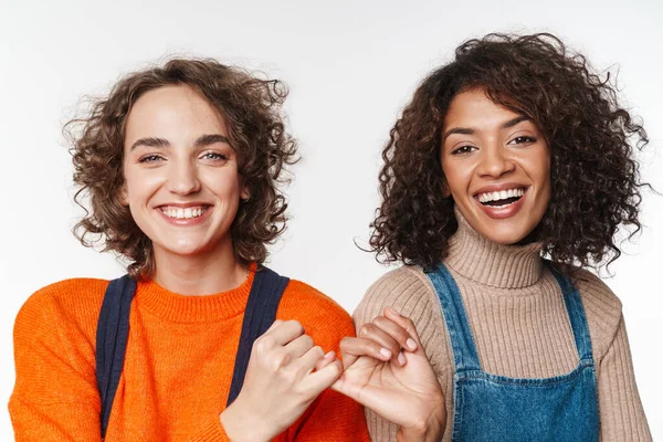 Portrait Beautiful Multinational Women Overalls Smiling Holding Pinkies Together Isolated — Stock Photo, Image