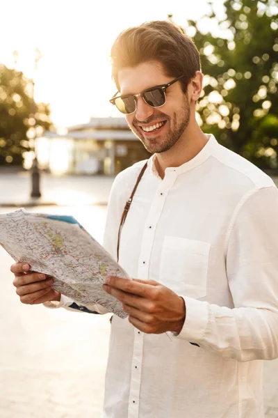 Image Young Caucasian Handsome Man Smiling Holding Paper Map While — Stock Photo, Image