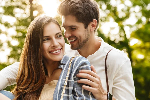 Image Young Caucasian Happy Brunette Couple Smiling Hugging While Walking — Stock Photo, Image